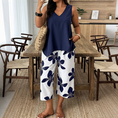 🌸 ¡TIEMPO LIMITADO 50% DE DESCUENTO! ✨ Set de camiseta asimétrica y pantalones capri con estampado floral para mujer – versátil, vibrante, cómodo 🌺